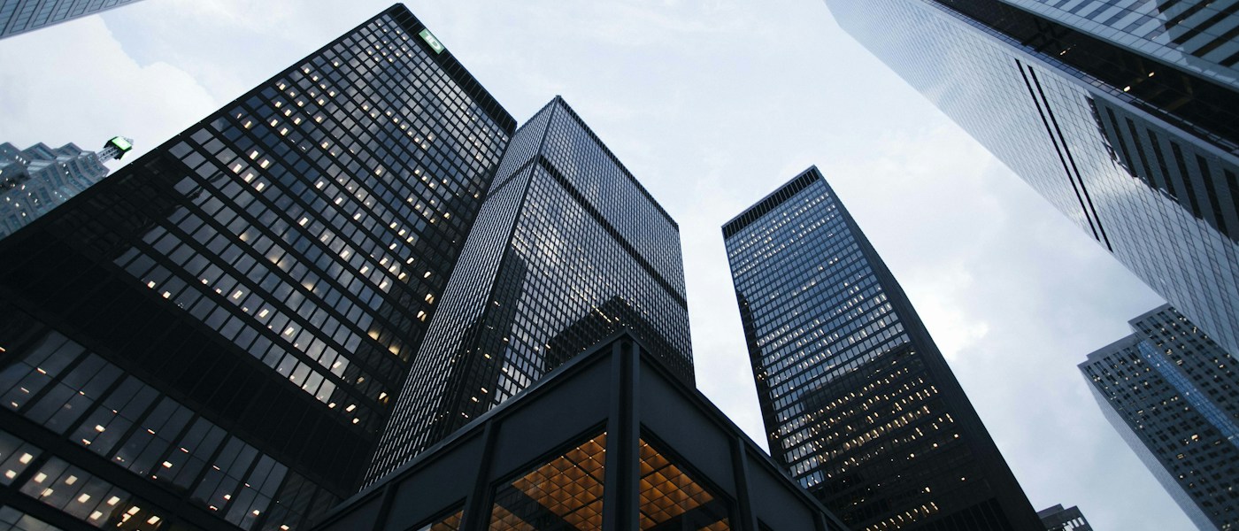 Modern architectural forms rising against a clear sky